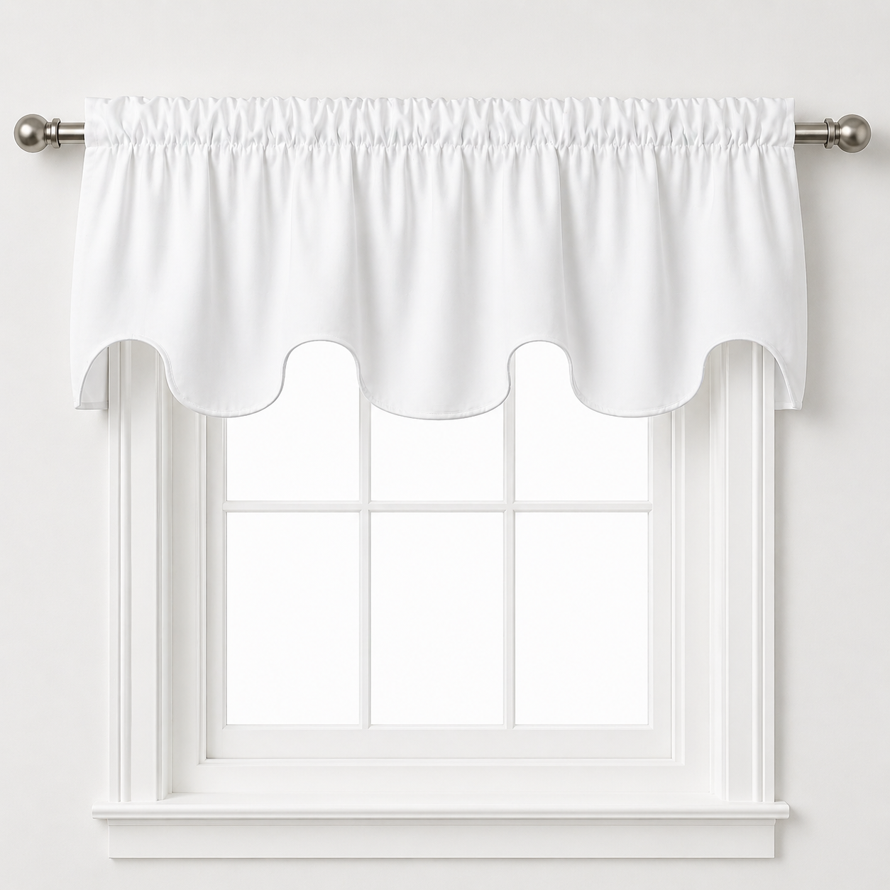 a white window with a white valance hanging above it.