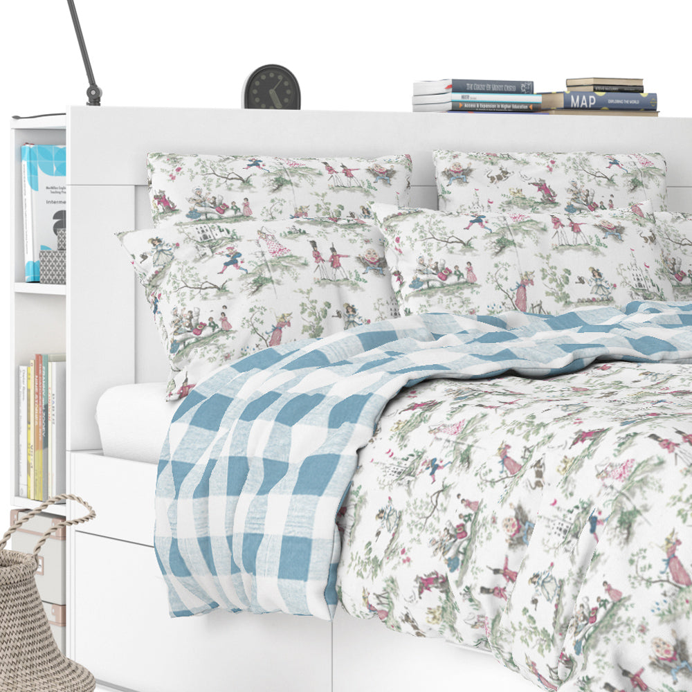 a white bed with a blue and white checkered comforter and matching pillows, along with a bookshelf and a clock in the background.