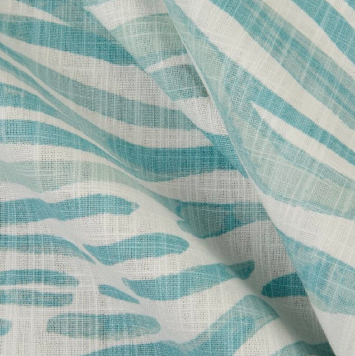 pinch pleated curtains in babur cancun blue watercolor wavy stripe